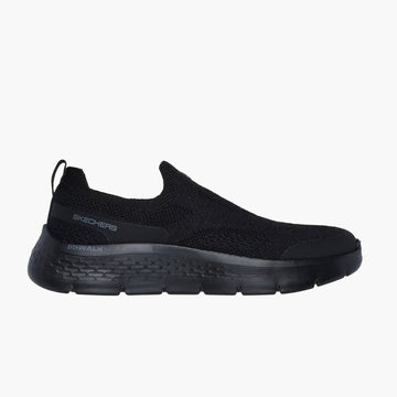 Black slip-on sneaker on a white background
