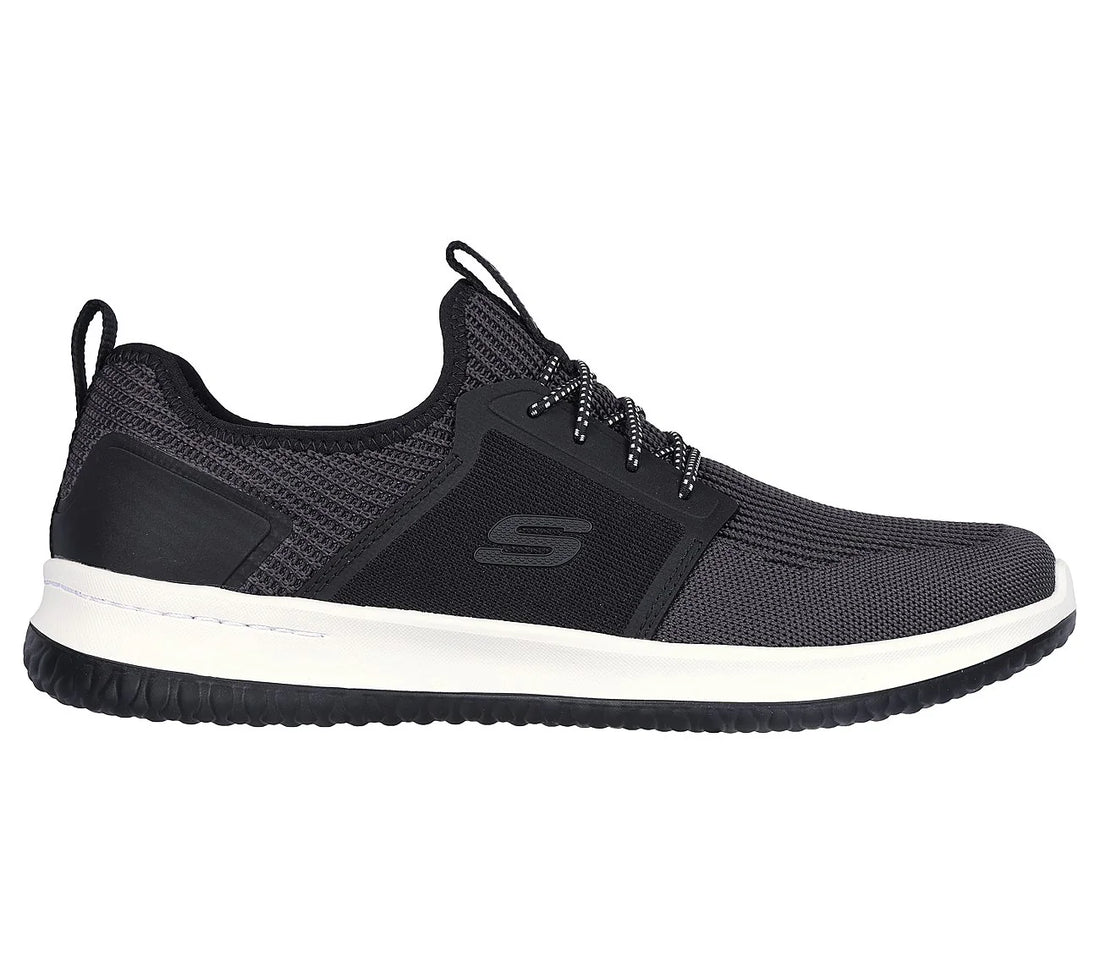 Black sneaker with white sole on a white background